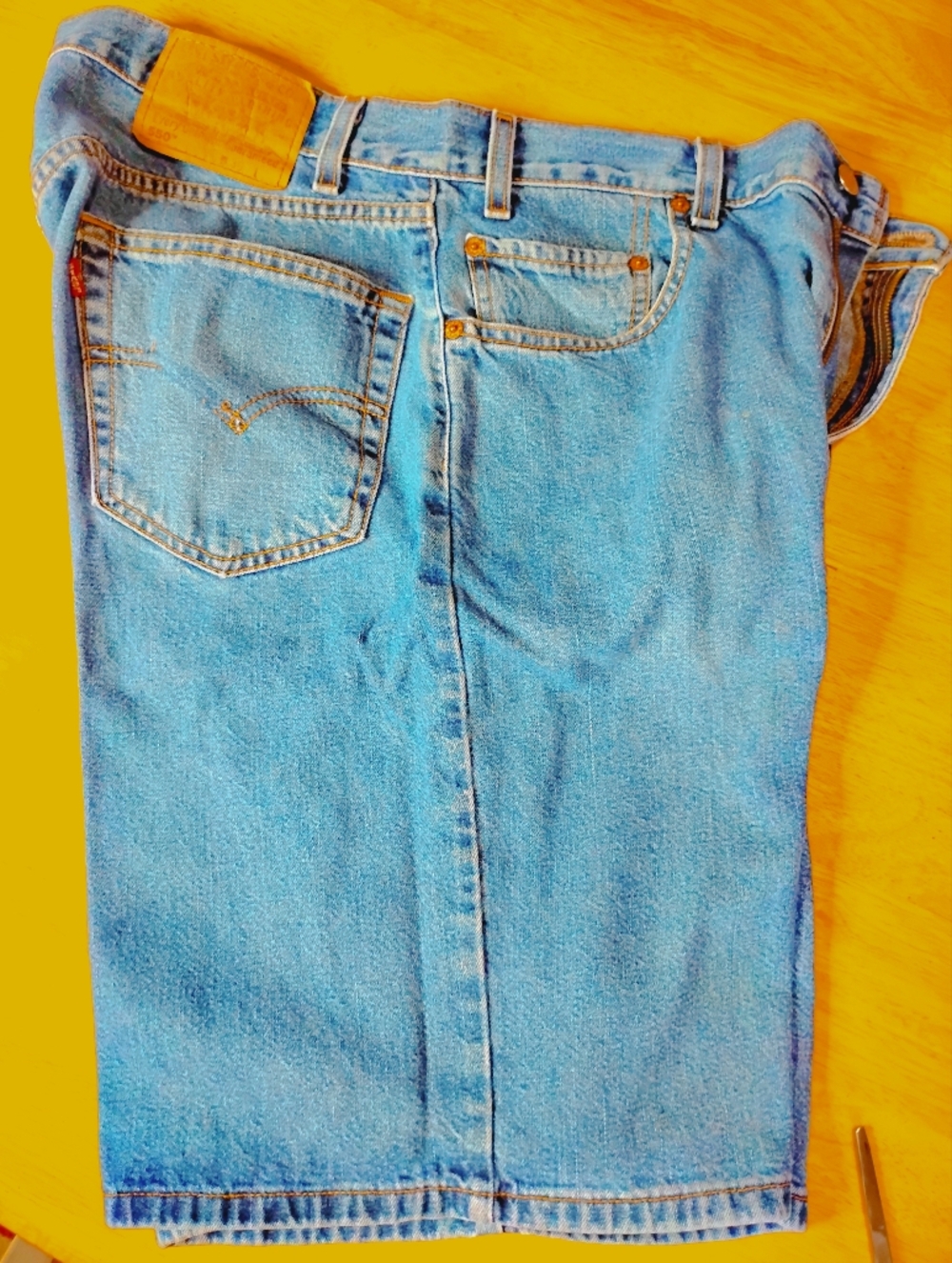 Levi's 550 Relaxed Fit Jeans - Light Blue Denim with Orange Stitching